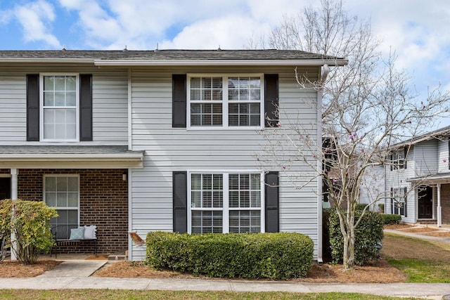 view of front of house with brick siding