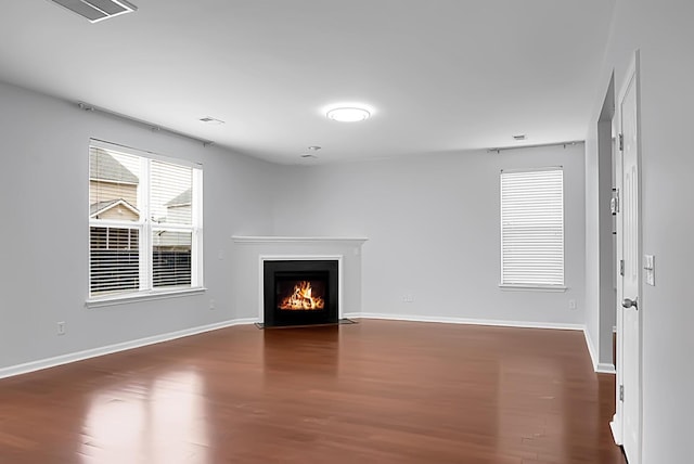 unfurnished living room featuring hardwood / wood-style flooring