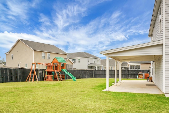 view of yard with a playground and a patio area