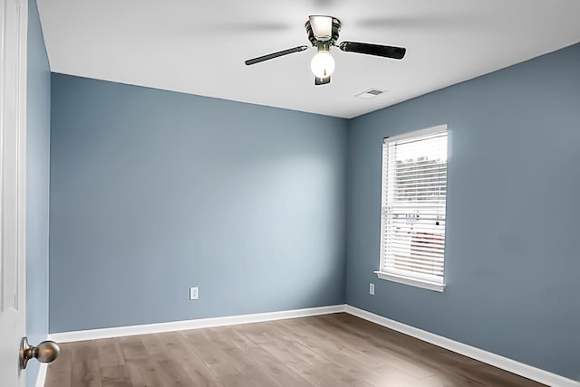 unfurnished room featuring hardwood / wood-style flooring and ceiling fan