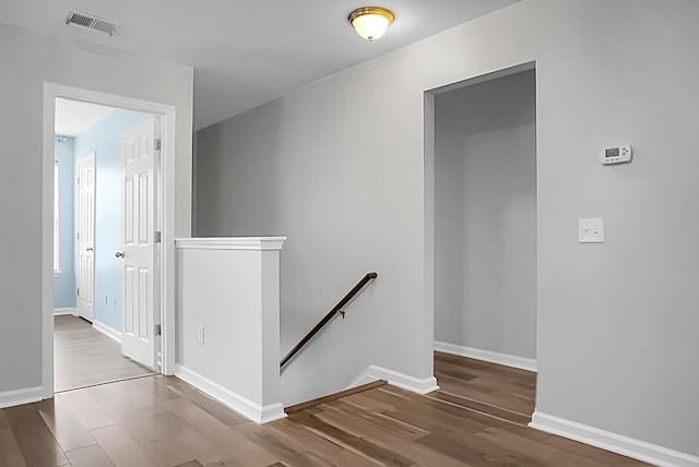 hallway featuring hardwood / wood-style flooring