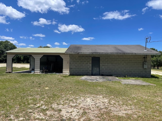 view of outdoor structure featuring a lawn