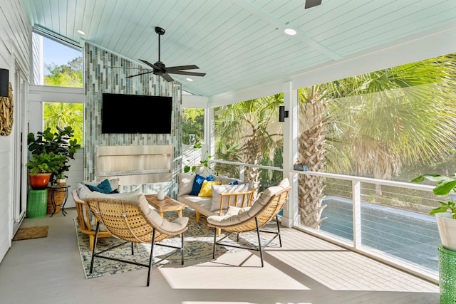 sunroom with ceiling fan and an outdoor hangout area