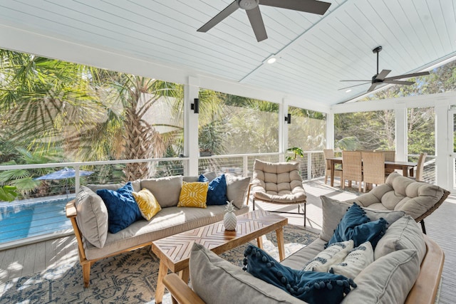 sunroom with an outdoor living space and ceiling fan