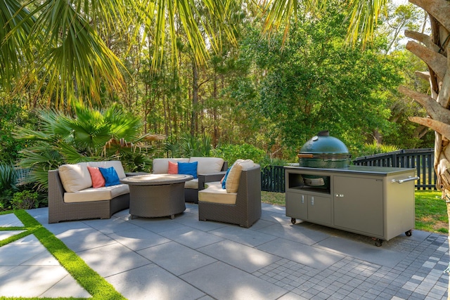 view of patio / terrace featuring fence and an outdoor living space