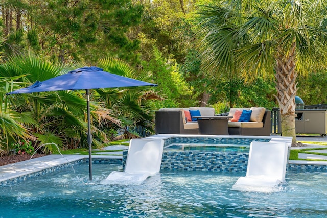 view of pool with a pool with connected hot tub