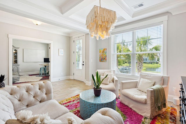 living area featuring visible vents, an inviting chandelier, coffered ceiling, and a healthy amount of sunlight
