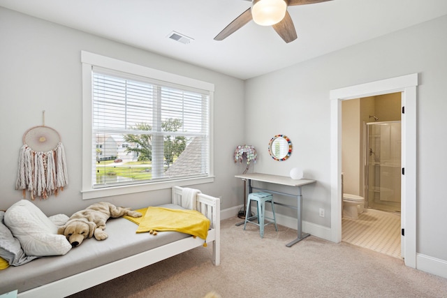 bedroom featuring visible vents, carpet flooring, baseboards, and ensuite bathroom