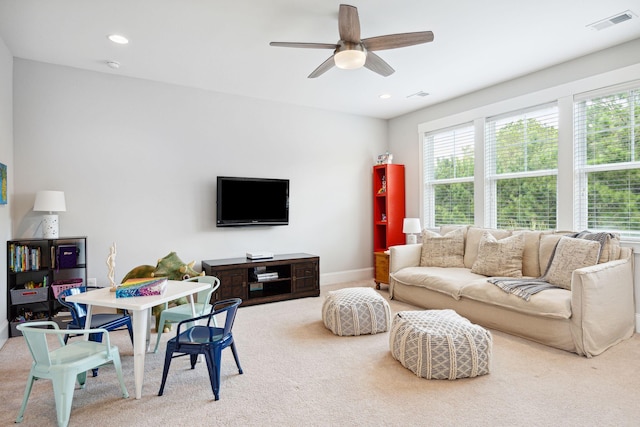 carpeted living room featuring baseboards, visible vents, recessed lighting, and ceiling fan