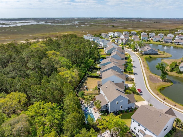 birds eye view of property with a residential view and a water view