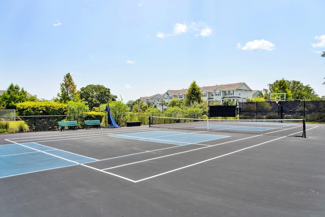 view of sport court featuring fence and community basketball court