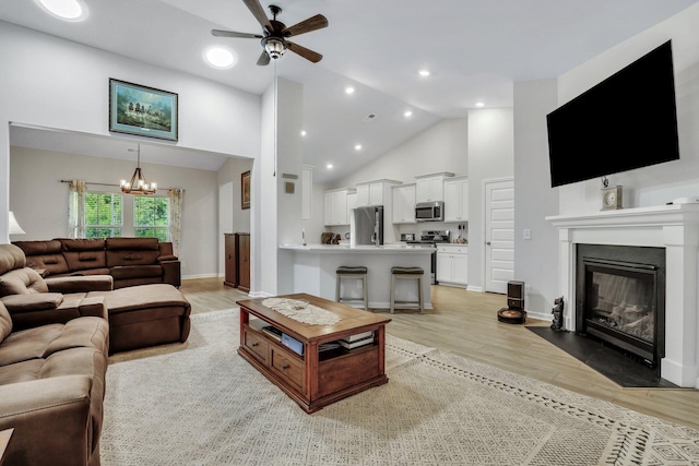 516 Yellow Leaf Ln, Summerville, SC 29486 - living area featuring light wood-style flooring, a fireplace with flush hearth, and high vaulted ceiling