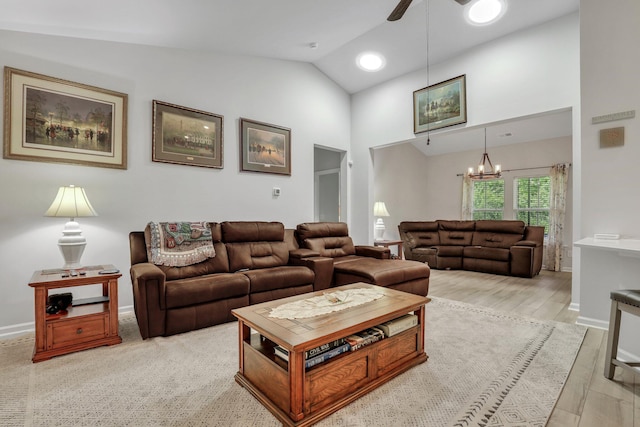 516 Yellow Leaf Ln, Summerville, SC 29486 - living room with ceiling fan with notable chandelier, light wood-type flooring, and baseboards