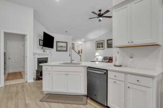 516 Yellow Leaf Ln, Summerville, SC 29486 - kitchen with a peninsula, a sink, decorative backsplash, vaulted ceiling, and stainless steel dishwasher