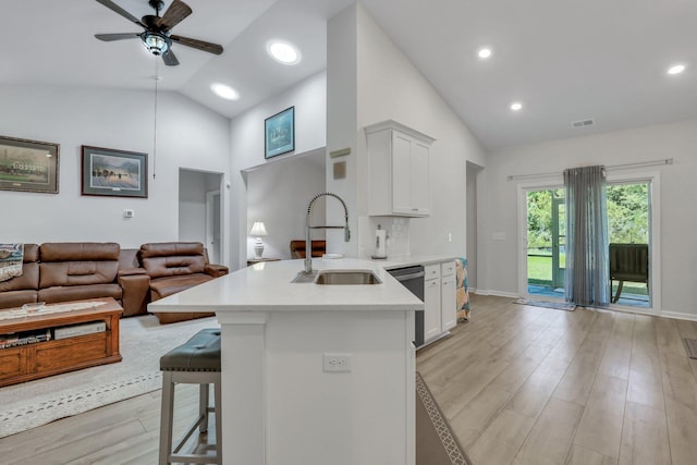 516 Yellow Leaf Ln, Summerville, SC 29486 - kitchen featuring a sink, a kitchen breakfast bar, stainless steel dishwasher, open floor plan, and light countertops
