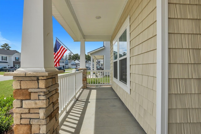 balcony featuring a residential view and covered porch