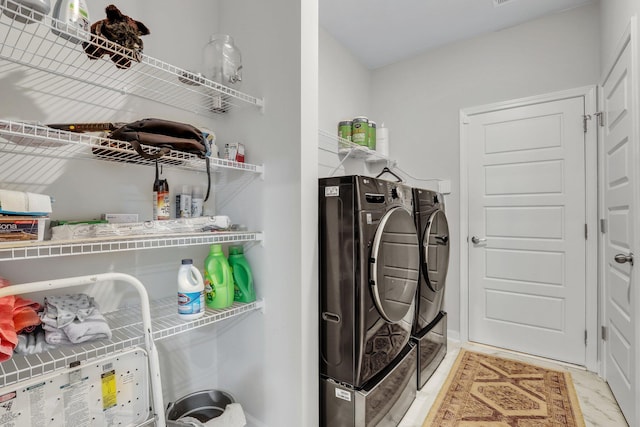 laundry area with washer and dryer