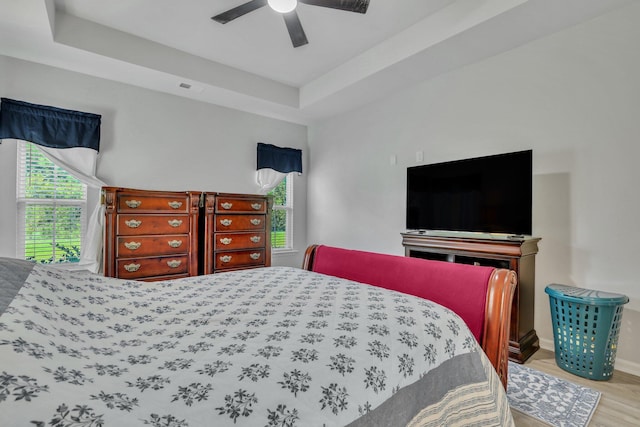 516 Yellow Leaf Ln, Summerville, SC 29486 - bedroom featuring ceiling fan, a tray ceiling, visible vents, and wood finished floors