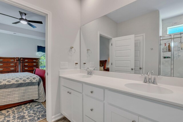 bathroom featuring ceiling fan, an enclosed shower, plenty of natural light, and vanity