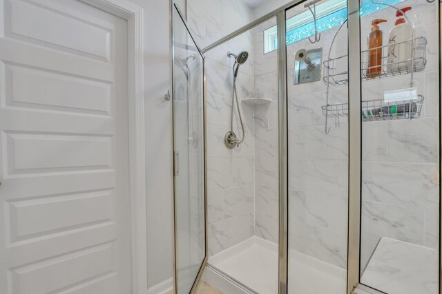 bathroom featuring an enclosed shower