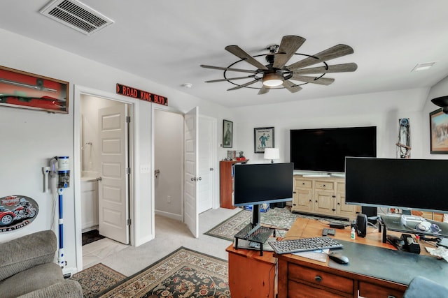 office space with light carpet and ceiling fan