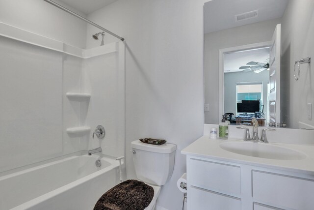 full bathroom featuring vanity, toilet, bathtub / shower combination, and ceiling fan