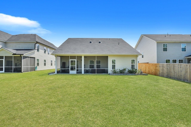 516 Yellow Leaf Ln, Summerville, SC 29486 - back of property featuring a yard, fence, a shingled roof, and a sunroom