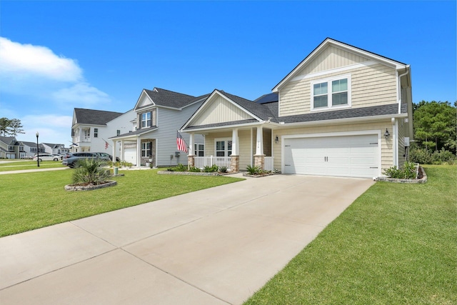 516 Yellow Leaf Ln, Summerville, SC 29486 - view of front of home featuring covered porch, an attached garage, concrete driveway, and a front lawn