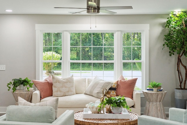 living area with a ceiling fan and recessed lighting