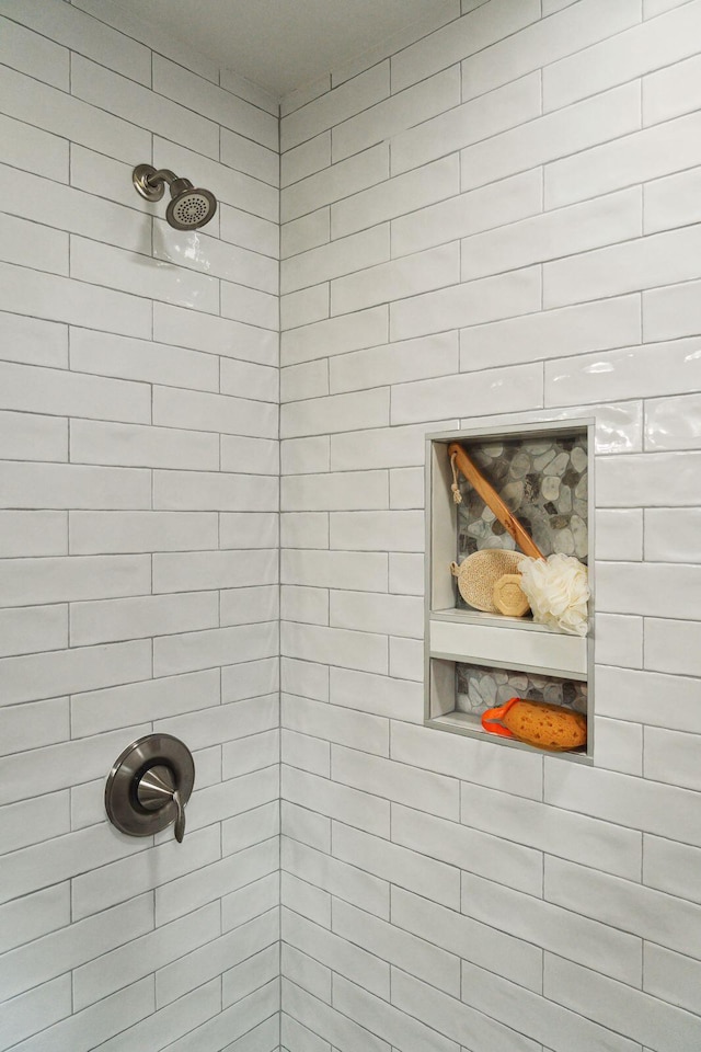 full bath featuring a tile shower