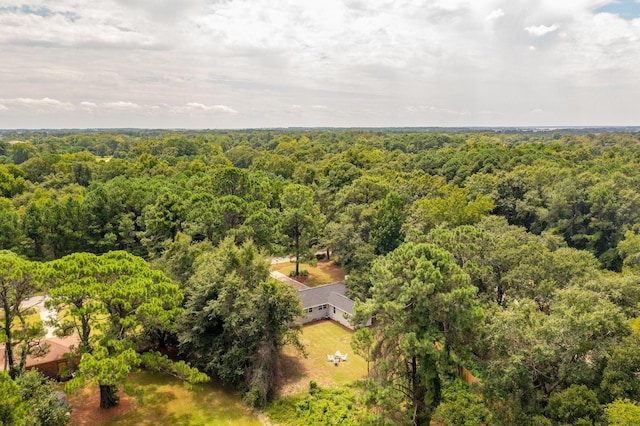 drone / aerial view featuring a forest view