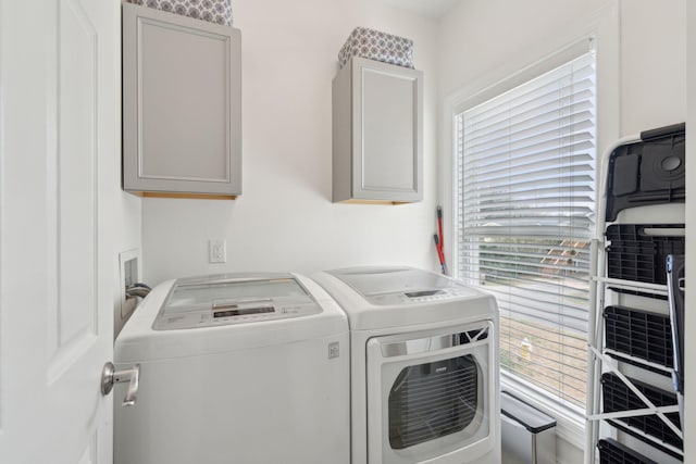 laundry room featuring cabinet space and washer and clothes dryer