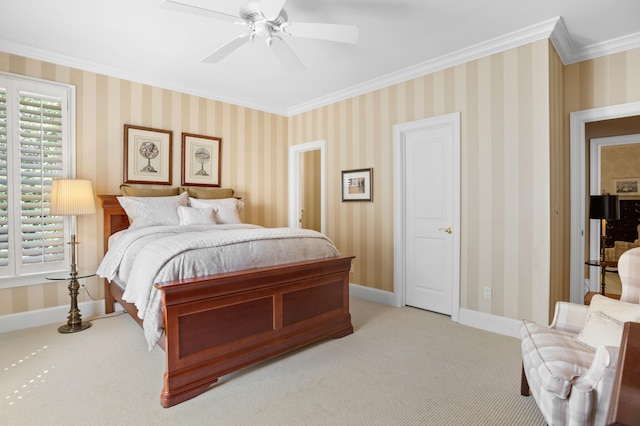 carpeted bedroom featuring ornamental molding and ceiling fan