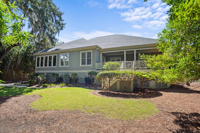 view of front of house with a front lawn and a wooden deck