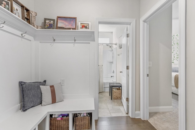 mudroom with light carpet