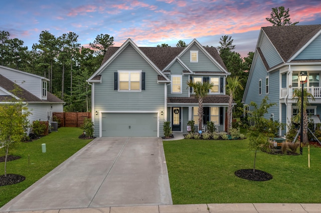 craftsman inspired home with central AC unit, a garage, and a yard