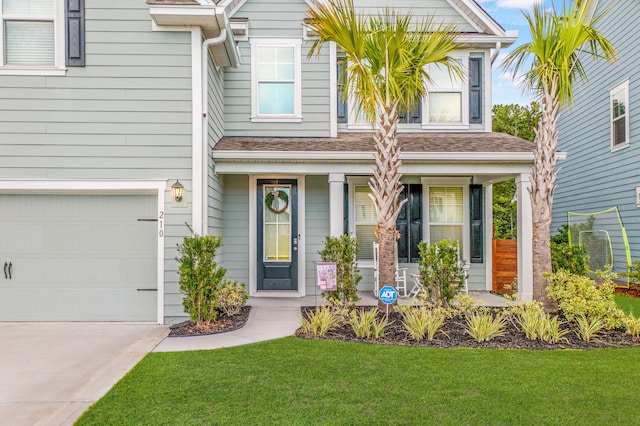 view of front of home with a garage and a front yard