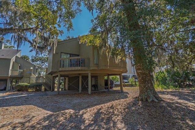 back of property with stairs