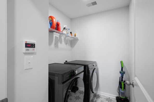 washroom featuring independent washer and dryer