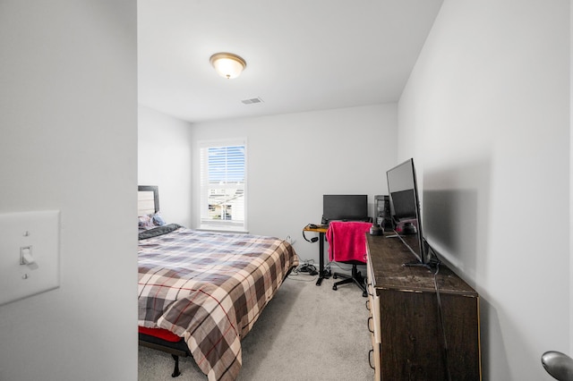 bedroom featuring light carpet