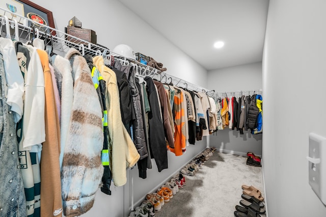 walk in closet featuring carpet floors