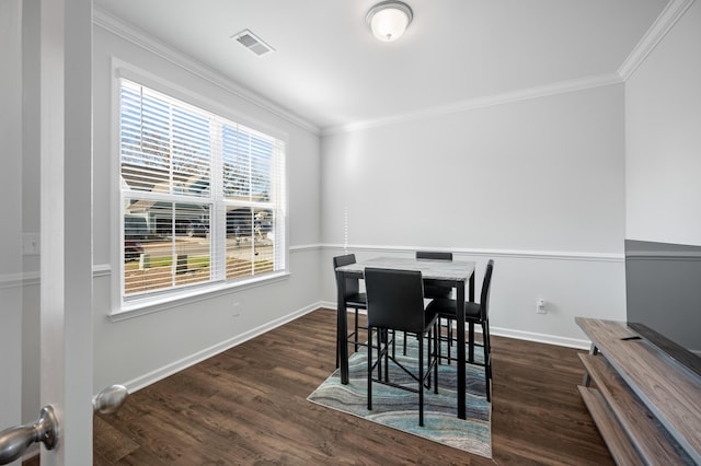 dining space with crown molding and dark wood-type flooring