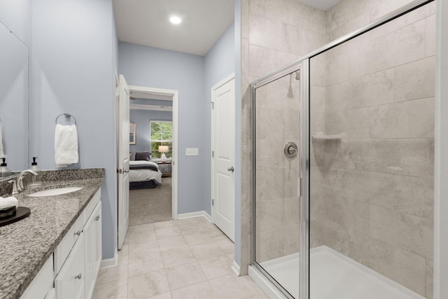 3438 Great Egret Dr, Johns Island, SC 29455 - ensuite bathroom with ensuite bathroom, a shower stall, vanity, tile patterned flooring, and baseboards