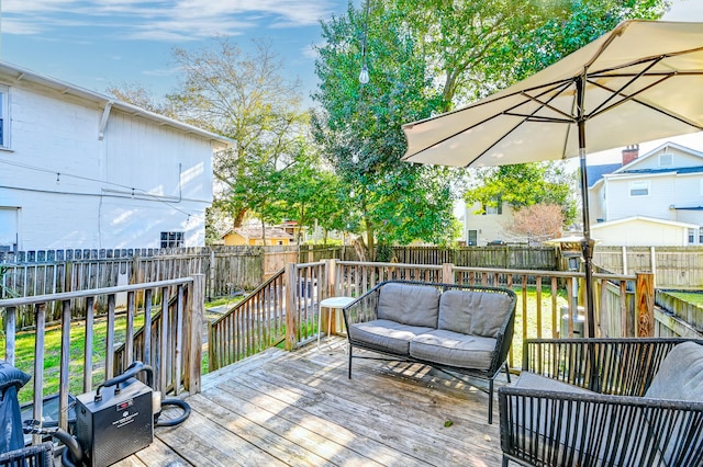 wooden terrace featuring outdoor lounge area