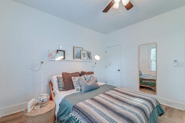 bedroom featuring ceiling fan and light hardwood / wood-style flooring