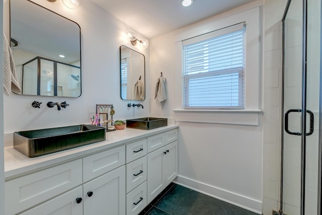 bathroom with tile patterned floors, walk in shower, and vanity