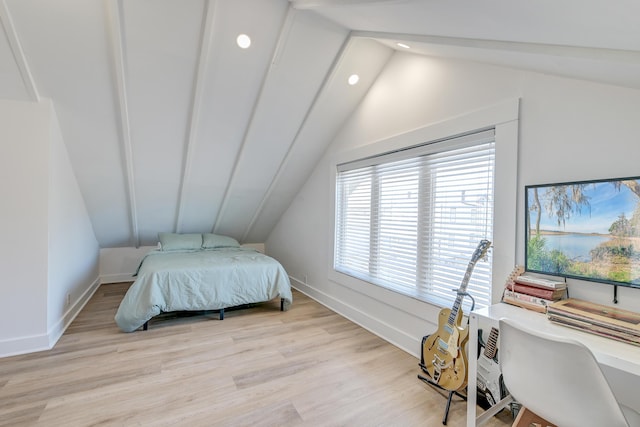 bedroom featuring light wood-type flooring and lofted ceiling