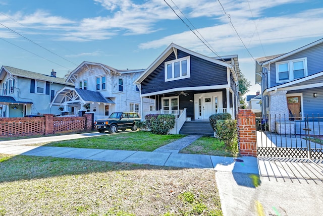 view of front of home with a front lawn and covered porch