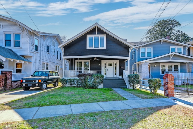 view of front of property featuring covered porch and a front yard