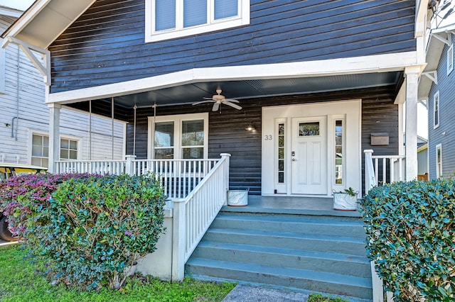 property entrance featuring ceiling fan and a porch